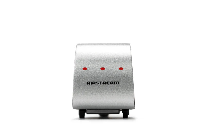 Silver Airstream wooden toy on a white background