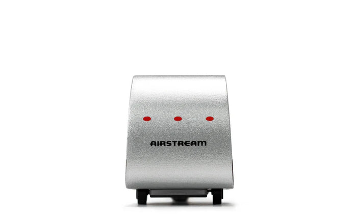 Silver Airstream wooden toy on a white background