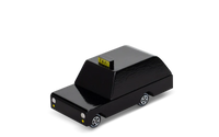 Black toy taxi with yellow 'TAXI' sign on a white background