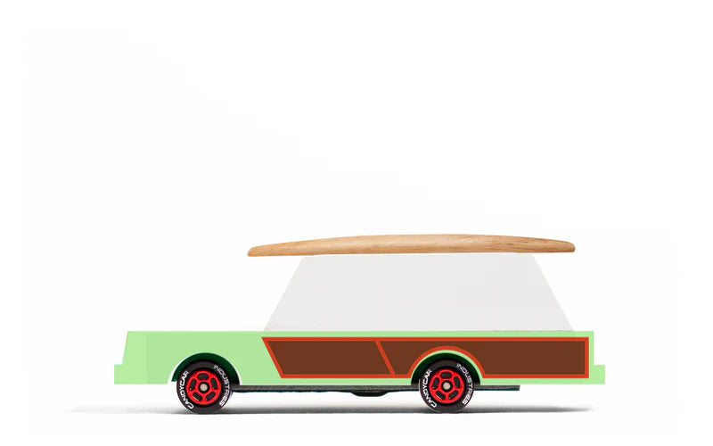 Toy truck with a surfboard on top on a white background