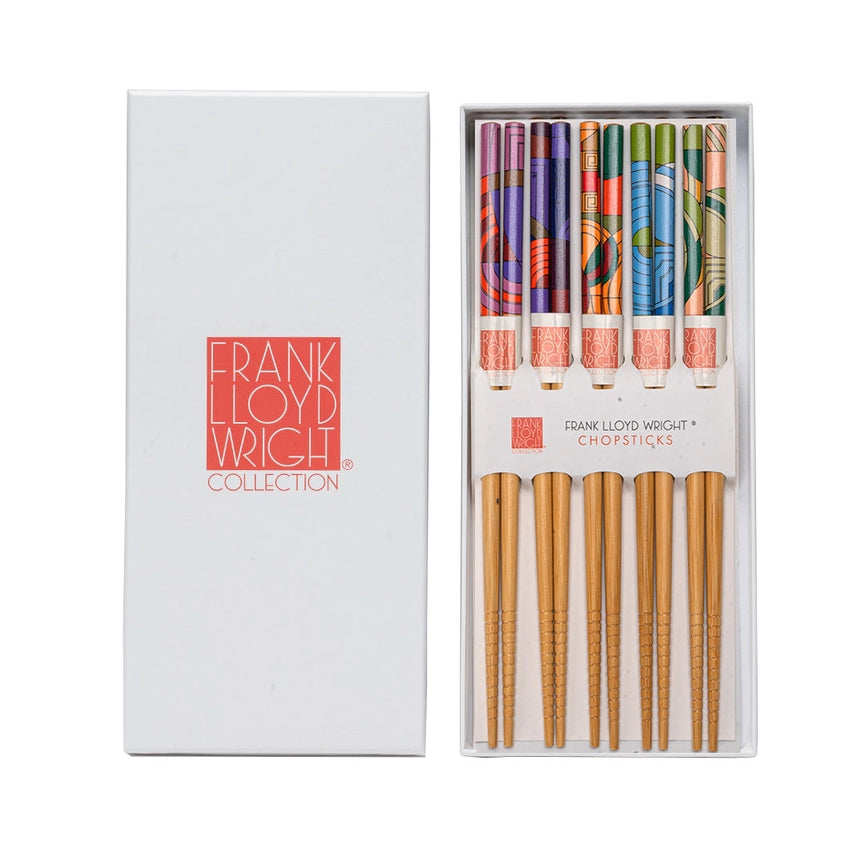 Set of chopsticks with patterned handles in a white box labeled 'Frank Lloyd Wright Collection'.