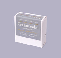Box of cream cake strawberry flavor on a gray background