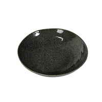 Black ceramic plate on a white background