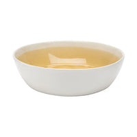 white ceramic cereal bowl with yellow inside on white background