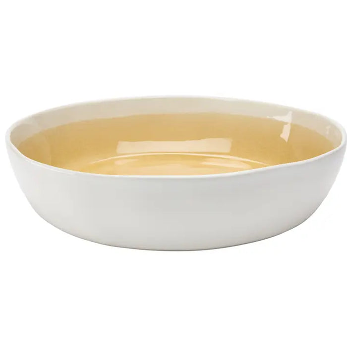 White bowl with yellow interior on a white background
