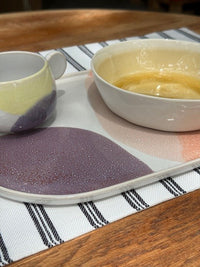 pastel colored oval plate with yellow and white bowl