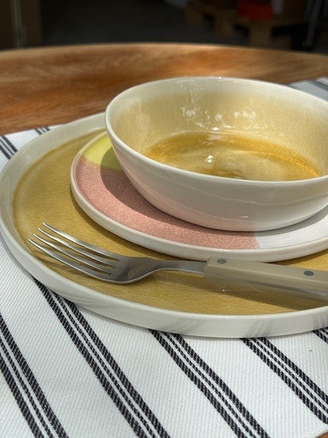 tableware on table with black and white striped background