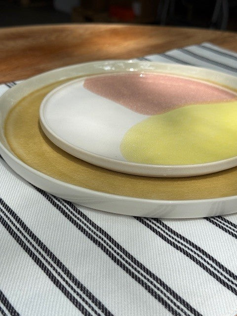dinner and side plate on striped placemat