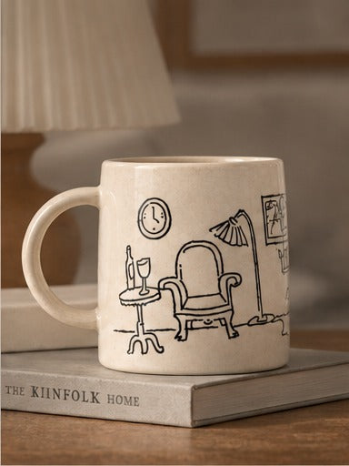 beige mug with interior design illustration on a book 