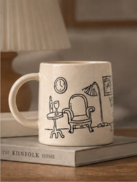 beige mug with interior design illustration on a book 