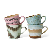 4 mugs with ears in different colors on a white background
