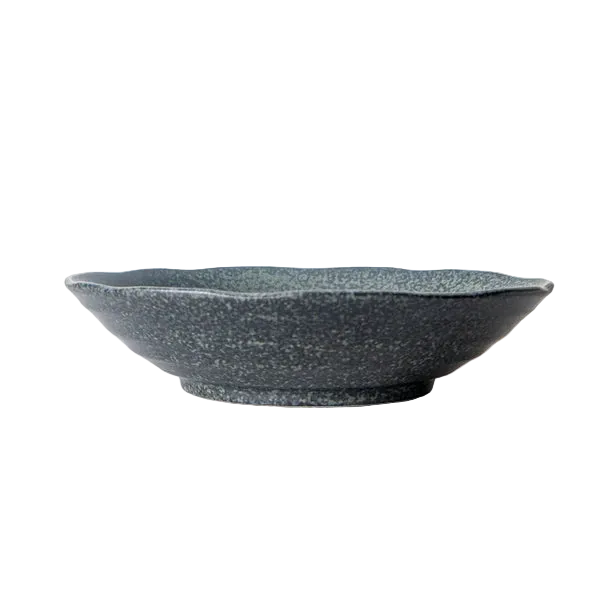 Speckled gray ceramic bowl on a white marble surface