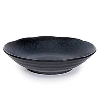 Black ceramic bowl on a white background