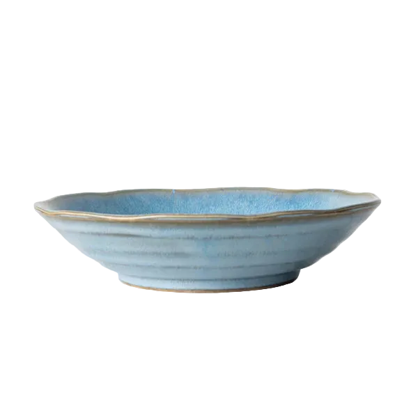 Blue ceramic bowl on a white surface