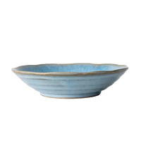 Blue ceramic bowl on a white surface