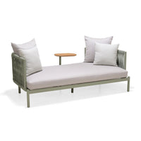 Modern outdoor sofa with cushions and a small table on a white background
