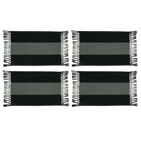 Set of four black and white striped placemats with fringe on a white background
