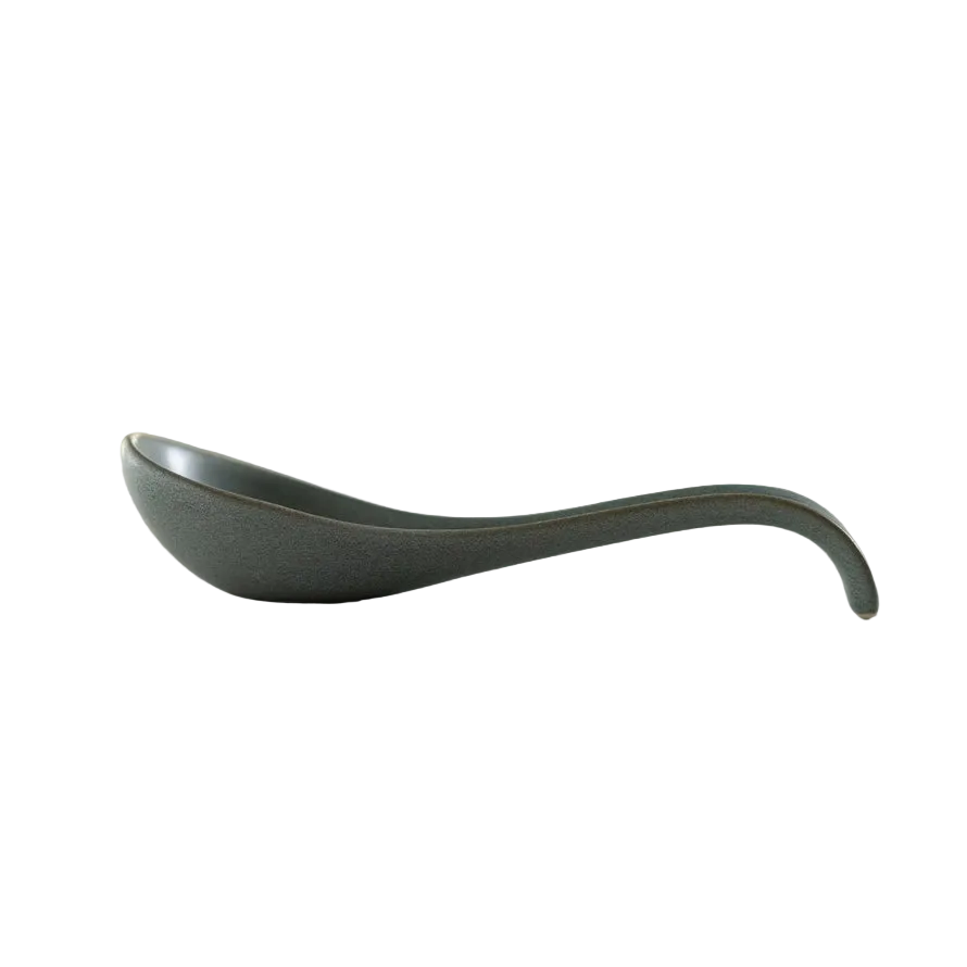 Gray ladle on a white surface 