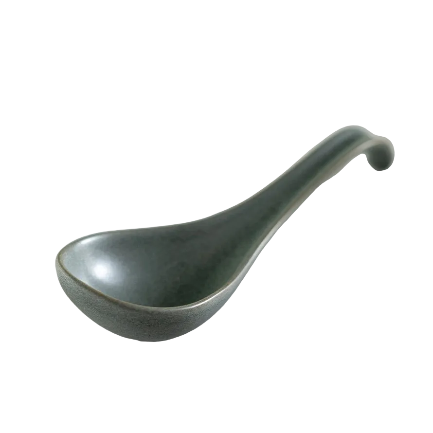 Green ceramic ladle on white background