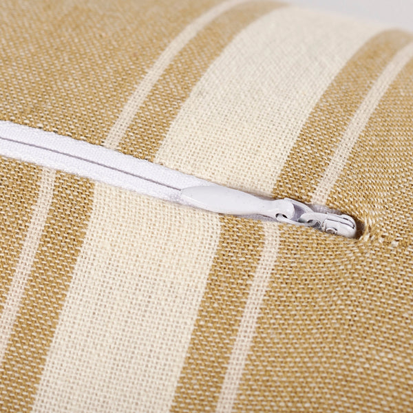 White zipper on a beige and white striped fabric background