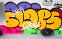 Colorful graffiti-style text on a blurred background