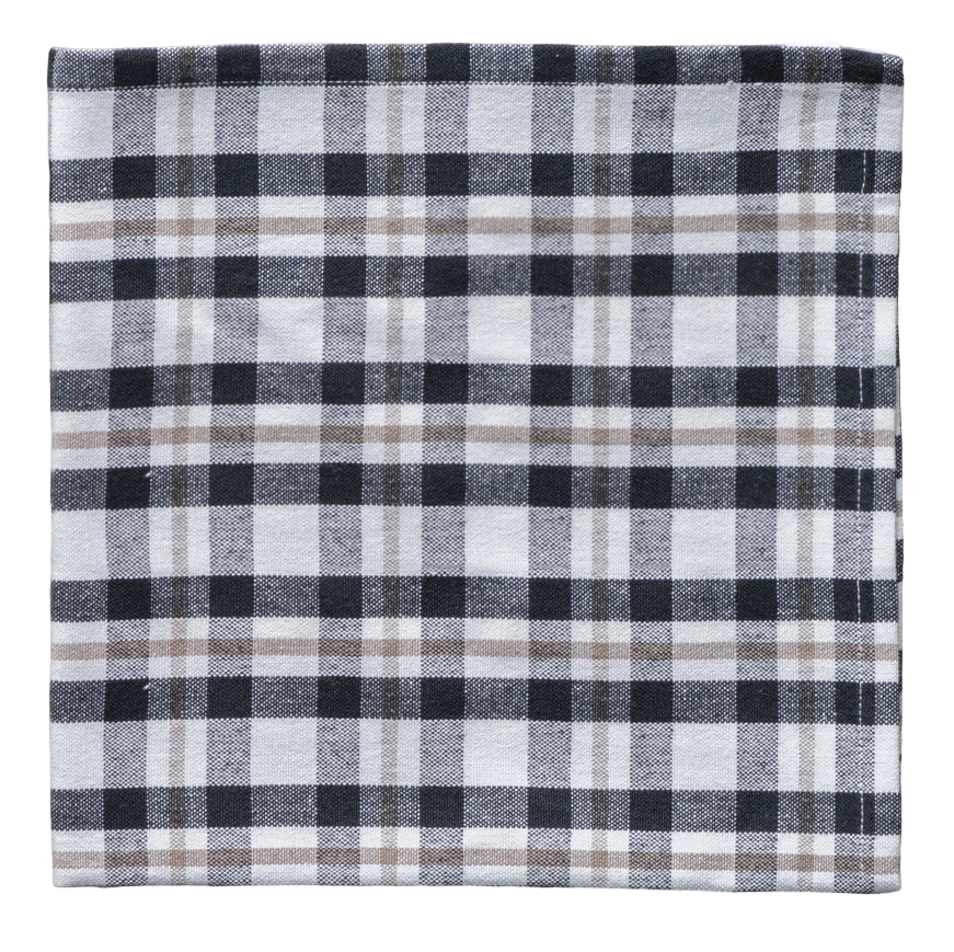 Plaid fabric napkin with black, white, and gray colors on a white background