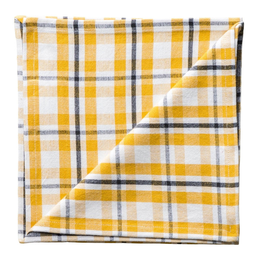 Yellow and white plaid fabric on a gray background