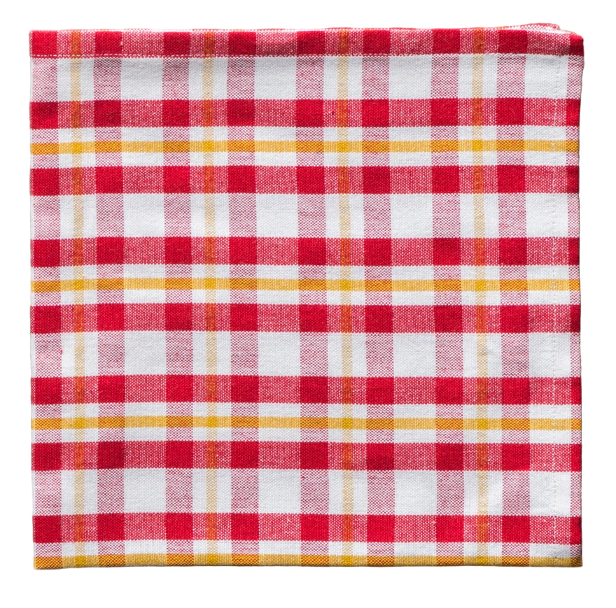 Red, white, and yellow checkered fabric  napkin on a white background