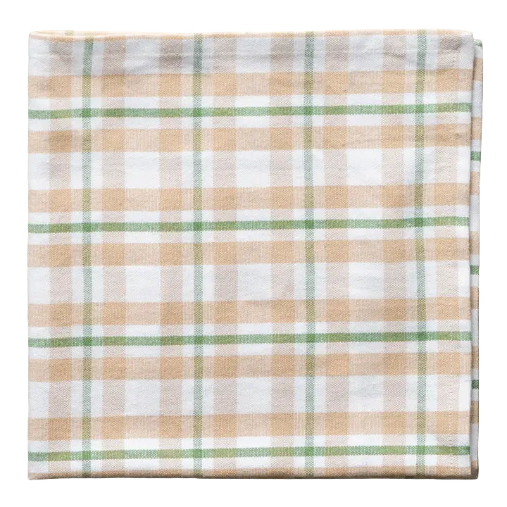 Plaid fabric with beige, green, and white pattern on a white background