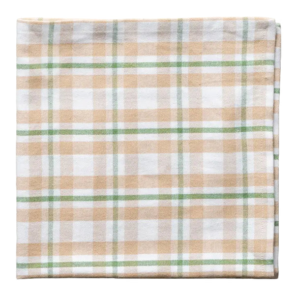 Plaid fabric with beige, green, and white pattern on a white background