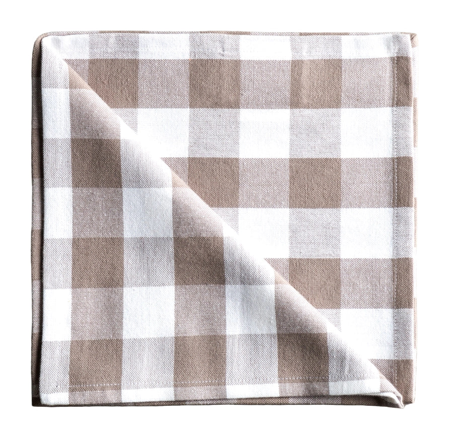 Folded checkered napkin with brown and white pattern on a gray background