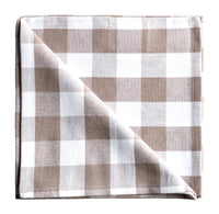 Folded checkered napkin with brown and white pattern on a gray background