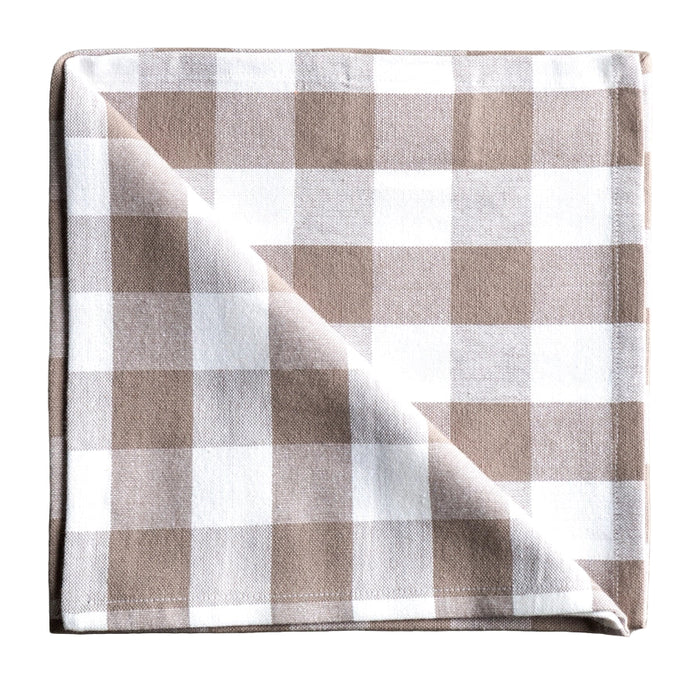 Folded checkered napkin with brown and white pattern on a gray background
