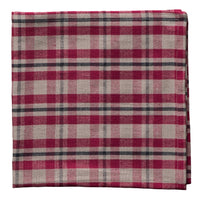Folded cotton napkin with a red and gray plaid pattern on a white background