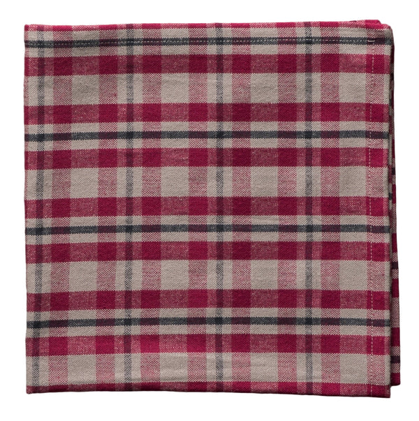 Folded cotton napkin with a red and gray plaid pattern on a white background
