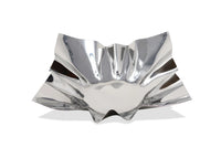 Silver decorative bowl with wavy design on a white background
