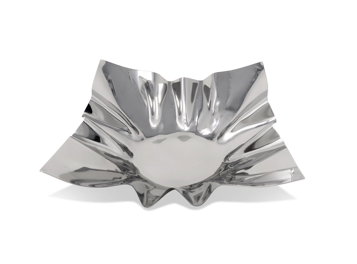 Silver decorative bowl with a unique, wavy design on a white background