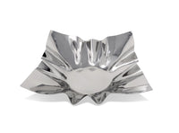 Silver decorative bowl with a unique, wavy design on a white background