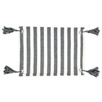 Striped fabric with tassels on a white background