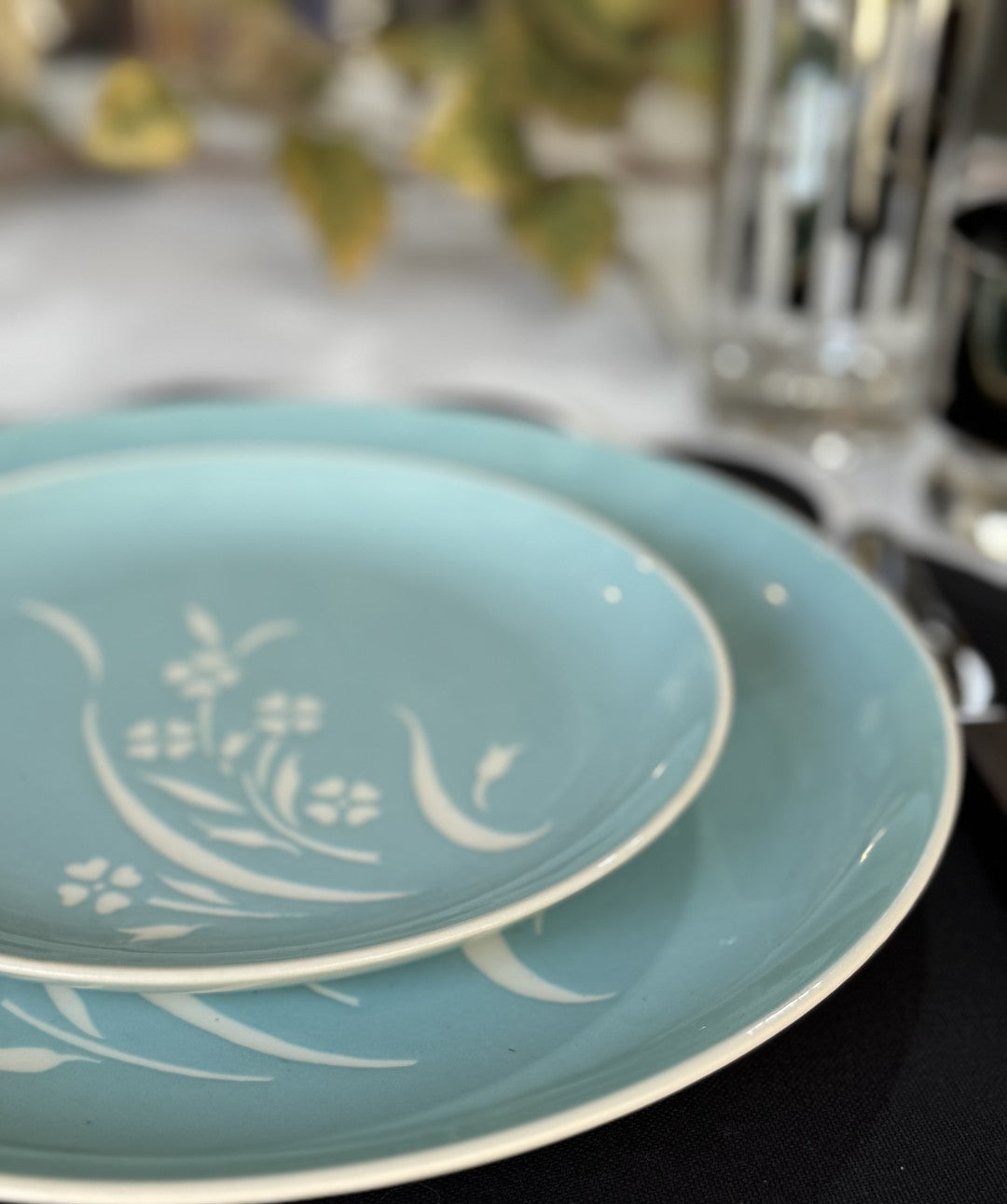 Blue and white vintage side plate on a dinner plate