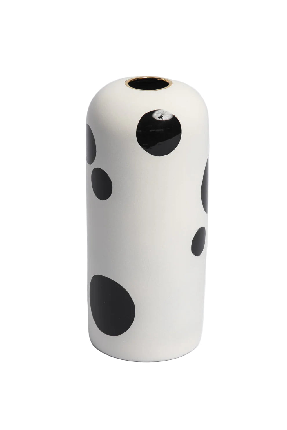 White vase with black polka dots on a white background