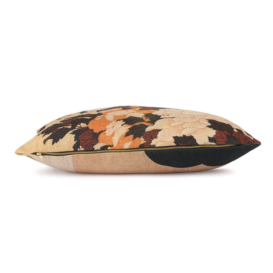 Decorative pillow with floral pattern on a beige background