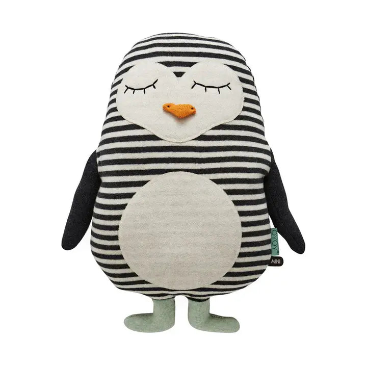 cotton toy penguin with black and white striped body on a white background