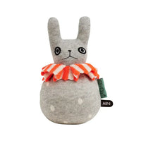 Gray plush toy with a red and white striped bow tie on a white background