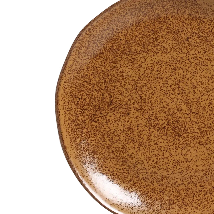 Brown ceramic plate with reactive glaze on a white background