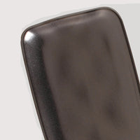 Close-up of a metallic surface with 'Reactive Glaze' text and 'Each Product is Unique' label.