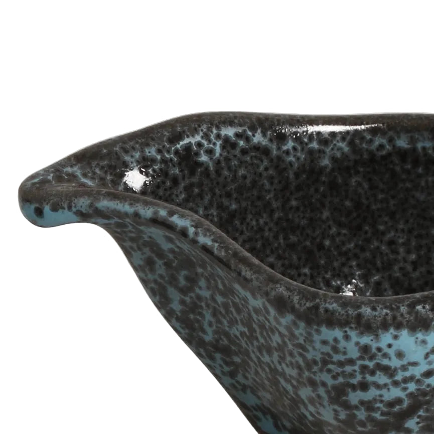 Ceramic bowl with reactive glaze on a white background