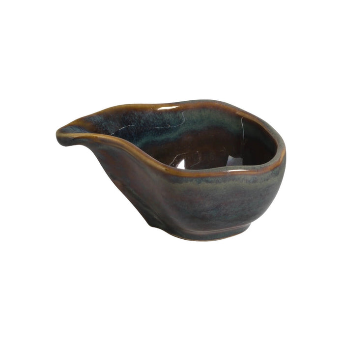 Ceramic gravy boat with a dark glaze on a white background