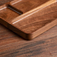 Close-up of a wooden cutting board on a wooden surface