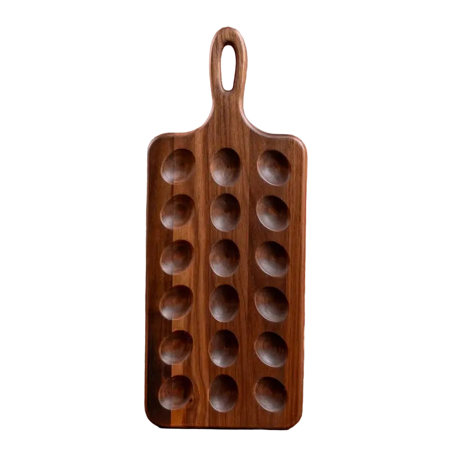 A dark brown wooden egg serving tray against a white background.